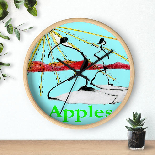 Abstract fruit art wall clock with red apples painting on a white face, light wood frame, hanging above a shelf with a small plant.