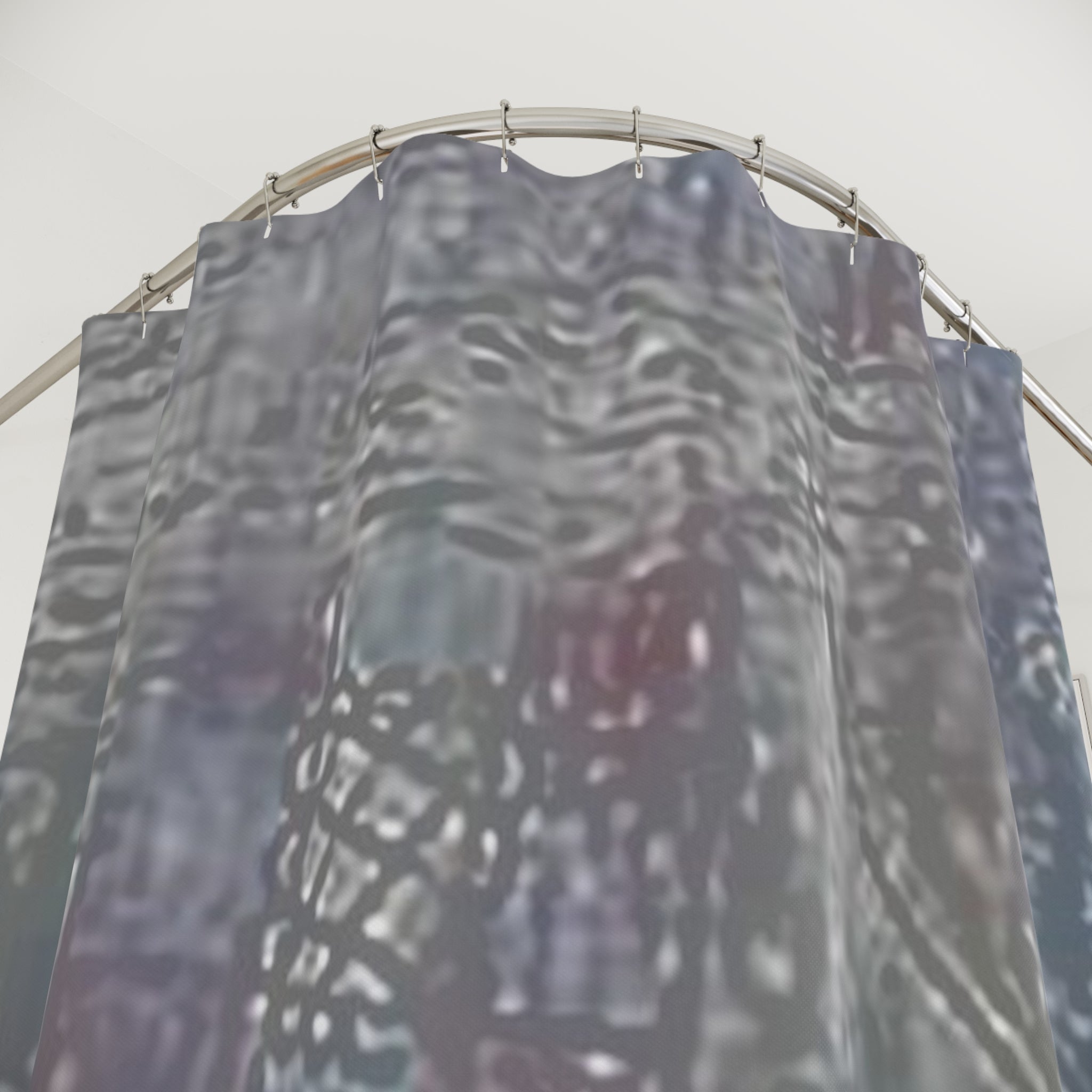 Textured abstract shower curtain detail in neutral grey and brown tones with subtle blue accent