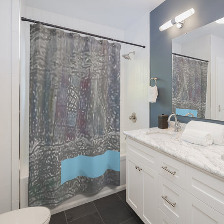 Modern bathroom styled with a neutral abstract shower curtain featuring a soft blue band