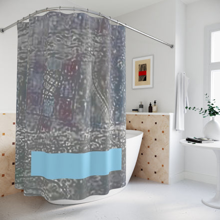 Designer shower curtain with minimalist abstract texture and muted blue detail in a contemporary bathroom