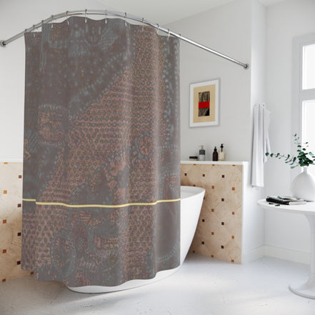 Designer patterned shower curtain in earth tones with a gold accent line in a contemporary bathroom