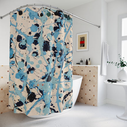 tatement shower curtain with abstract blue splatter artwork in a contemporary bathroom setting