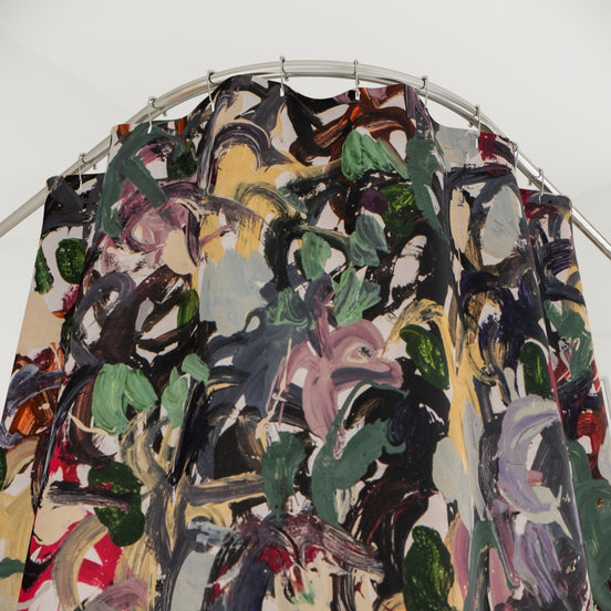 Close-up of colorful abstract shower curtain with expressive brushstrokes and multicolor paint texture