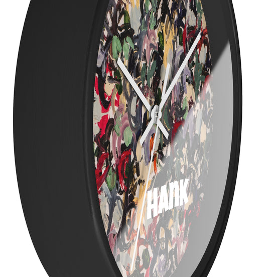Side view of HANK designer wall clock showing black base depth and layered abstract multicolor artwork.